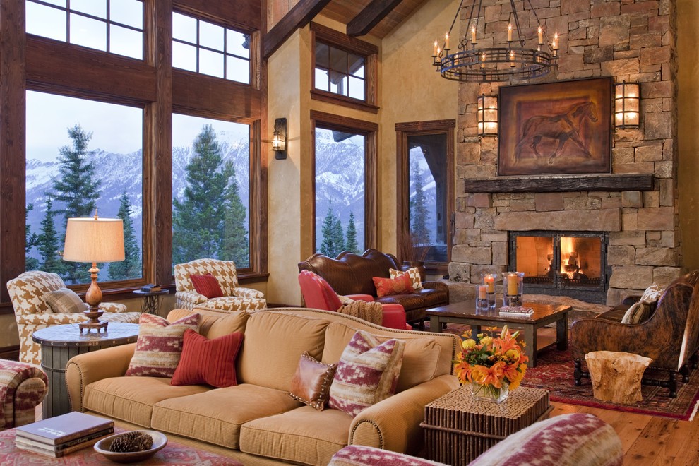 Design ideas for a large rustic formal living room in Other with beige walls, light hardwood flooring, a standard fireplace, a stone fireplace surround, no tv and brown floors.