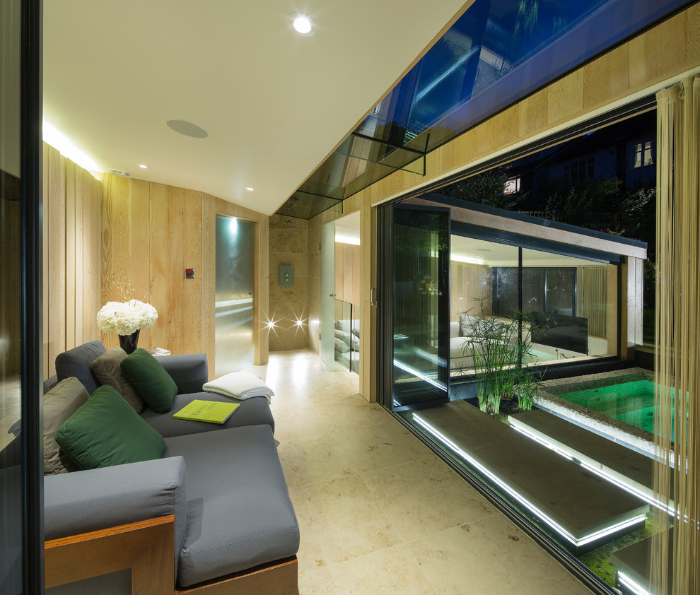 Идея дизайна: гостиная комната в современном стиле с бежевыми стенами без телевизора