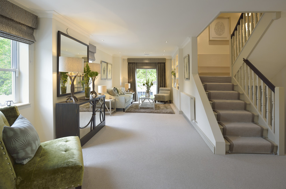 Medium sized contemporary formal open plan living room in London with carpet and grey floors.