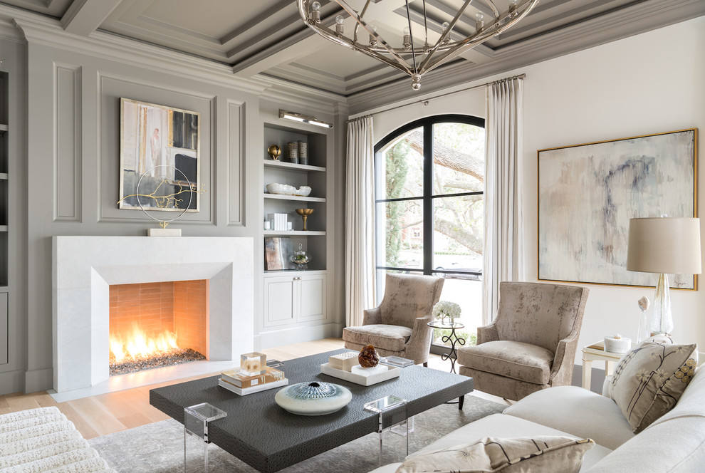 Inspiration for a large living room in Dallas with a standard fireplace, a stone fireplace surround, a coffered ceiling and grey walls.