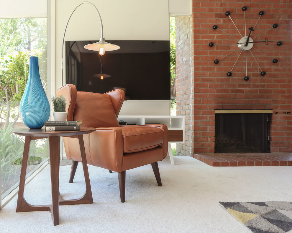 Inspiration for a medium sized midcentury formal open plan living room in San Francisco with carpet, a wall mounted tv, grey floors, beige walls, a standard fireplace and a brick fireplace surround.