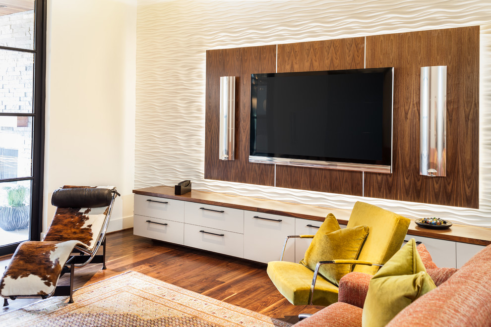Contemporary living room feature wall in Houston with white walls, dark hardwood flooring and a wall mounted tv.