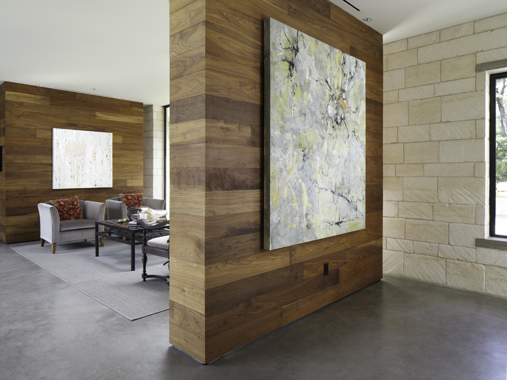 Example of a trendy concrete floor living room design in Austin