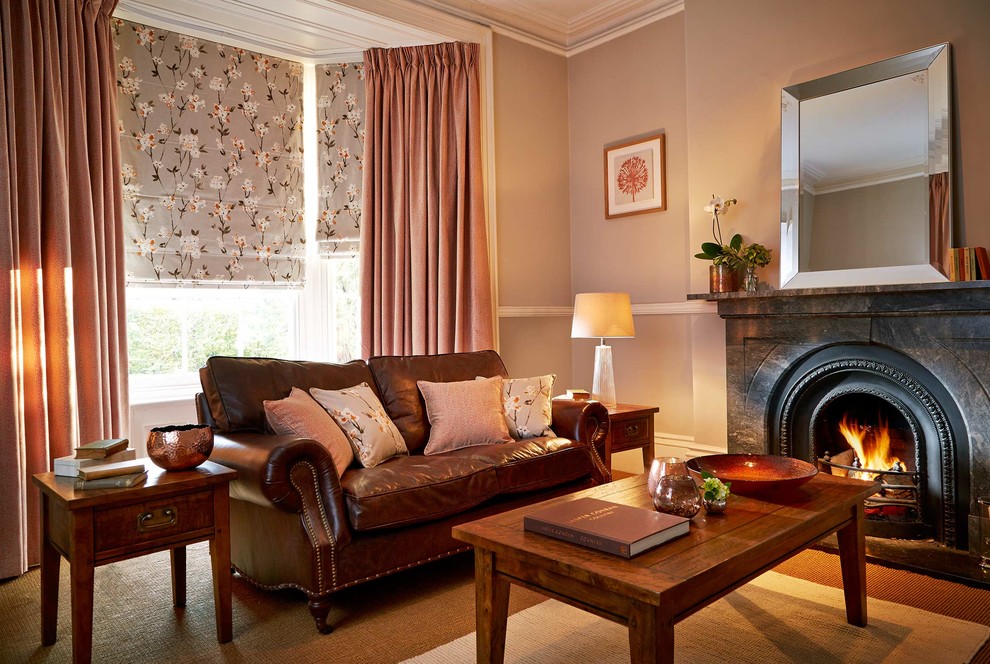 Contemporary enclosed living room in Other with grey walls, carpet, a standard fireplace and a stone fireplace surround.