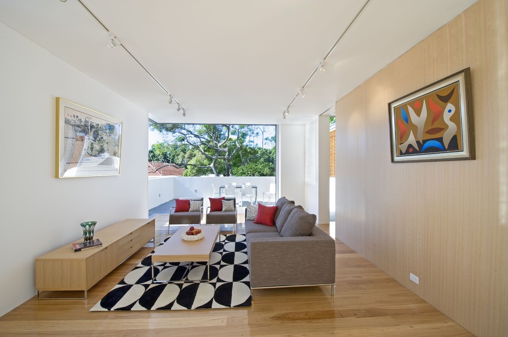 Living room - large contemporary open concept medium tone wood floor living room idea in Sydney