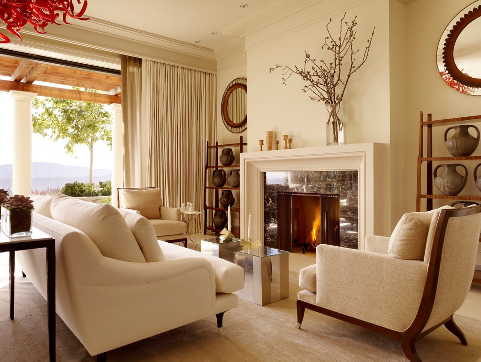 Inspiration for a transitional formal living room remodel in San Francisco with beige walls and a standard fireplace