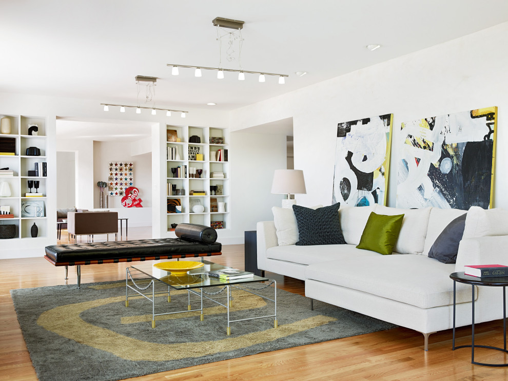 Example of a trendy open concept medium tone wood floor and brown floor living room design in San Francisco with white walls