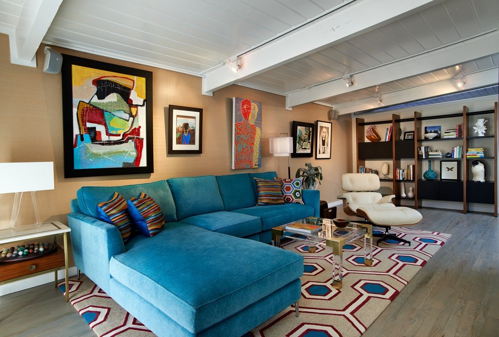 This is an example of a retro living room in Denver with beige walls and medium hardwood flooring.