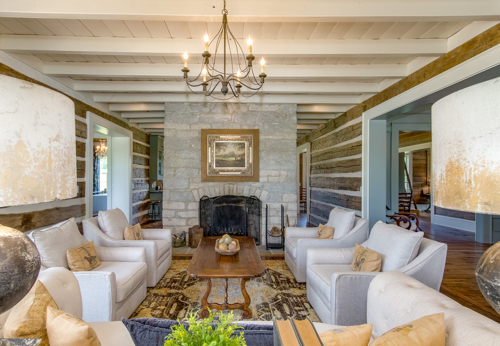 This is an example of a farmhouse formal living room in Nashville with brown walls, medium hardwood flooring, a standard fireplace and a stone fireplace surround.