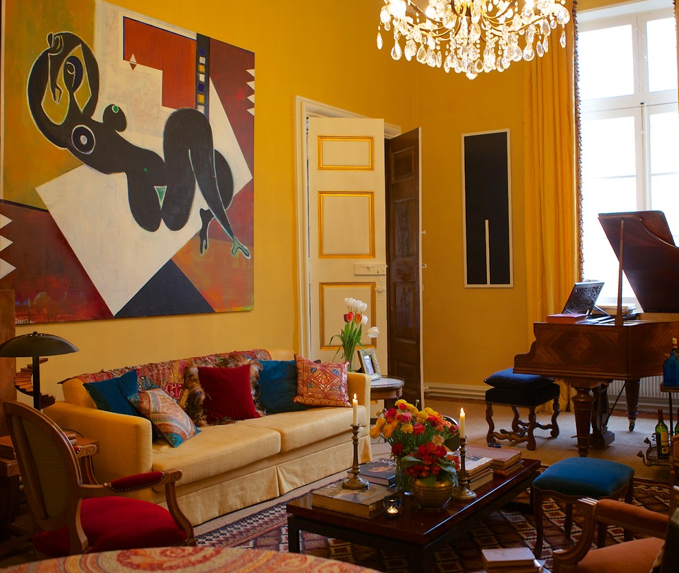 Photo of a large traditional open plan living room in Marseille with yellow walls, medium hardwood flooring, a standard fireplace, no tv and a music area.