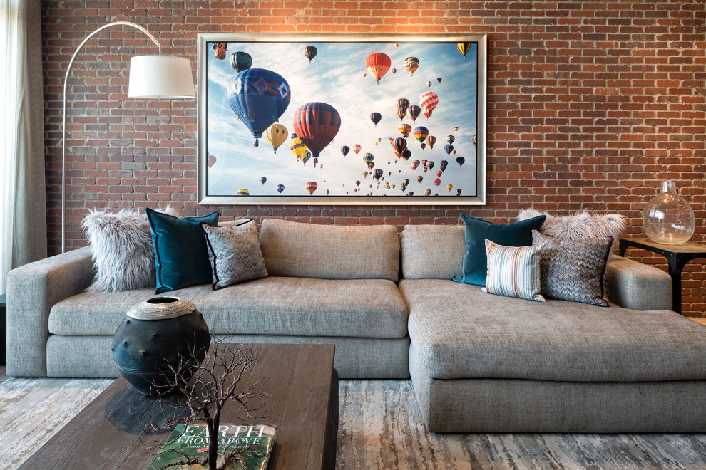 Photo of a small urban mezzanine living room in Minneapolis with brown walls, medium hardwood flooring and grey floors.