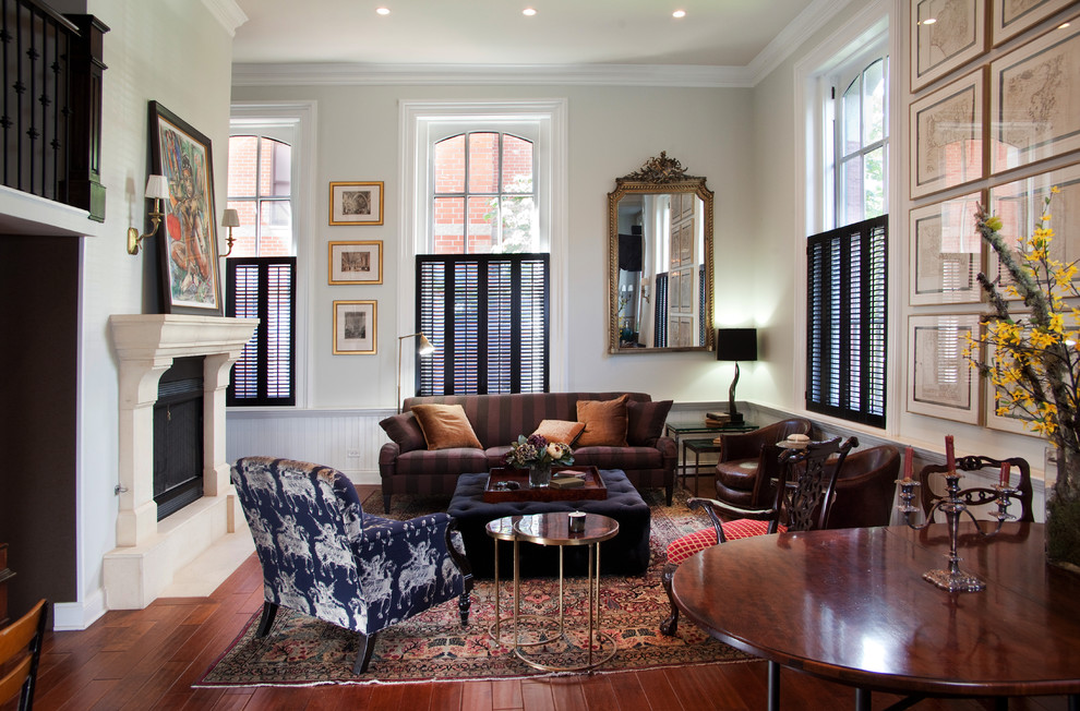Inspiration for a mid-sized timeless formal and open concept dark wood floor and brown floor living room remodel in Chicago with a standard fireplace, no tv and beige walls