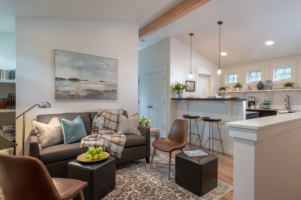 This is an example of a small traditional formal open plan living room in Other with beige walls, medium hardwood flooring, no fireplace, no tv and brown floors.