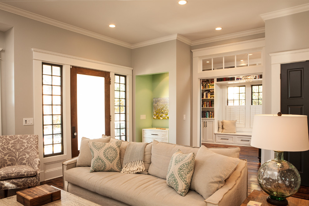 Classic enclosed living room in Atlanta with grey walls and feature lighting.