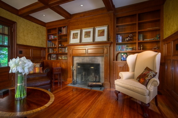 Photo of an expansive classic formal enclosed living room in Boston with yellow walls, medium hardwood flooring, a standard fireplace and a stone fireplace surround.