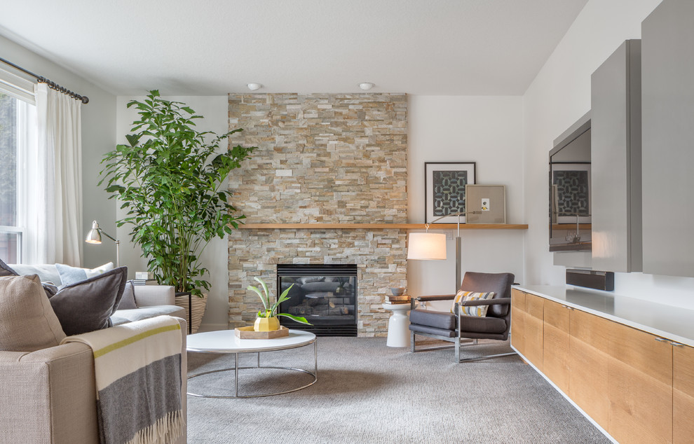 Mid-sized trendy enclosed carpeted living room photo in Portland with white walls, a standard fireplace, a brick fireplace and a wall-mounted tv