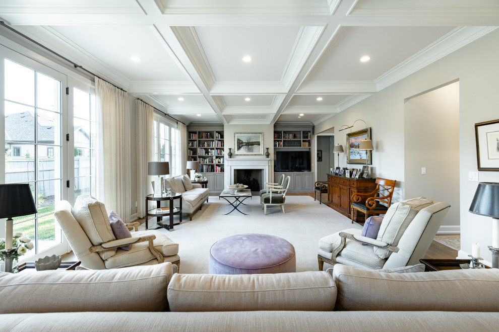 Elegant enclosed medium tone wood floor, brown floor and coffered ceiling living room photo in Salt Lake City with gray walls, a standard fireplace and a media wall