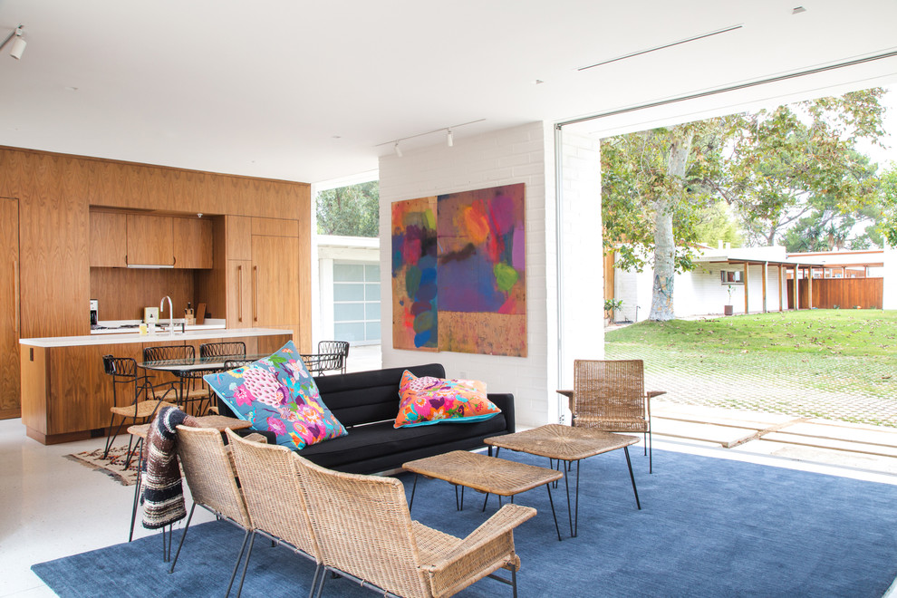 Photo of a midcentury open plan living room in Los Angeles with white walls.