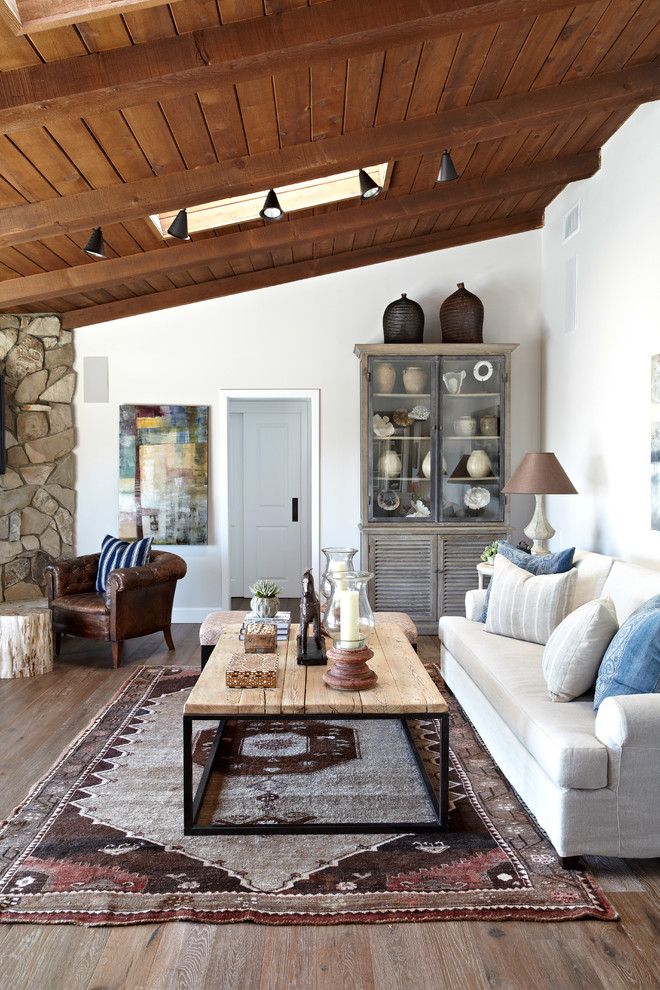 Inspiration for a timeless dark wood floor living room remodel in Los Angeles with white walls