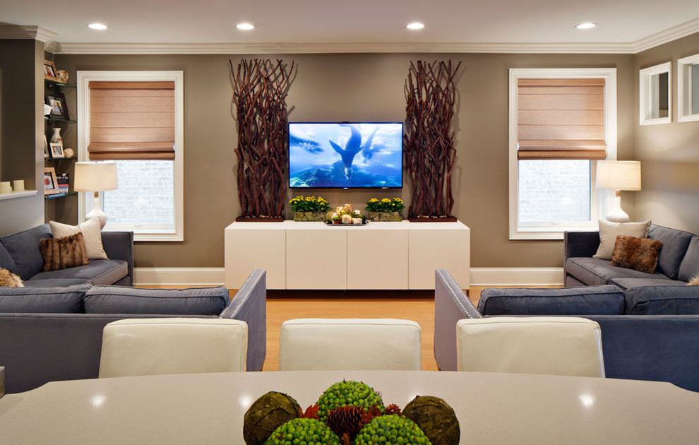 Large transitional open concept light wood floor living room photo in Chicago with brown walls and a wall-mounted tv