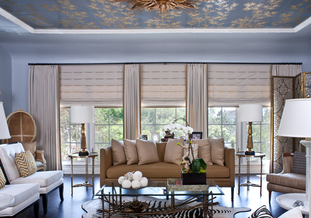 Example of a huge transitional living room design in Los Angeles with blue walls
