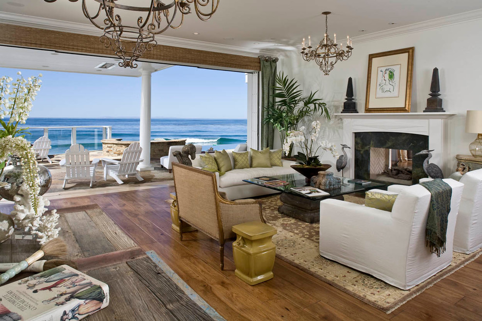 Inspiration for a beach style living room in Boise with medium hardwood flooring and a two-sided fireplace.