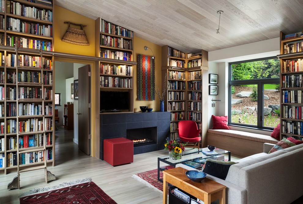 Contemporary living room in Minneapolis with a reading nook and yellow walls.