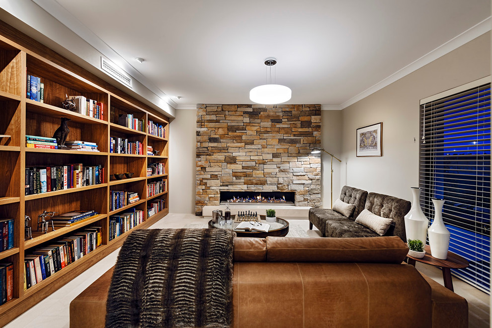 Idee per un soggiorno minimal chiuso con libreria, pareti grigie, camino lineare Ribbon e cornice del camino in pietra