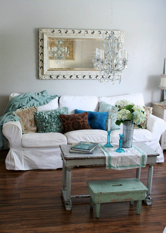 Inspiration for a shabby-chic style living room remodel in Other with white walls