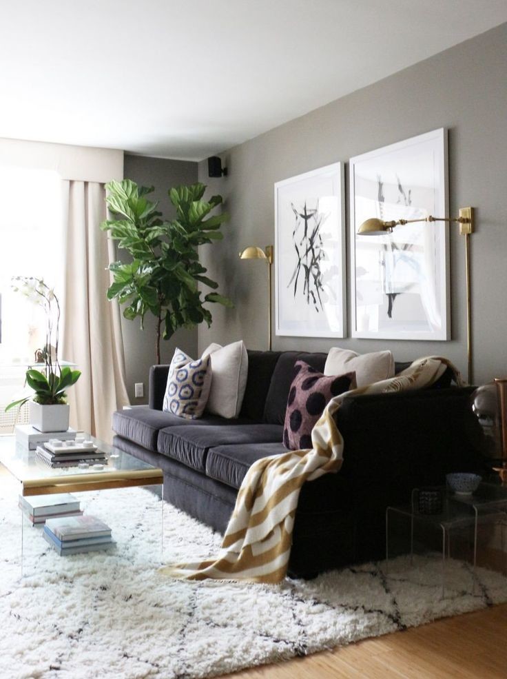 Scandinavian living room in Other with grey walls, medium hardwood flooring, no fireplace and feature lighting.