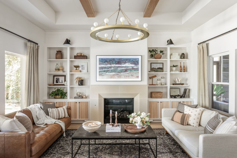 Medium sized classic open plan living room in Oklahoma City with white walls, light hardwood flooring, a standard fireplace, a concrete fireplace surround, a wall mounted tv, beige floors and a drop ceiling.