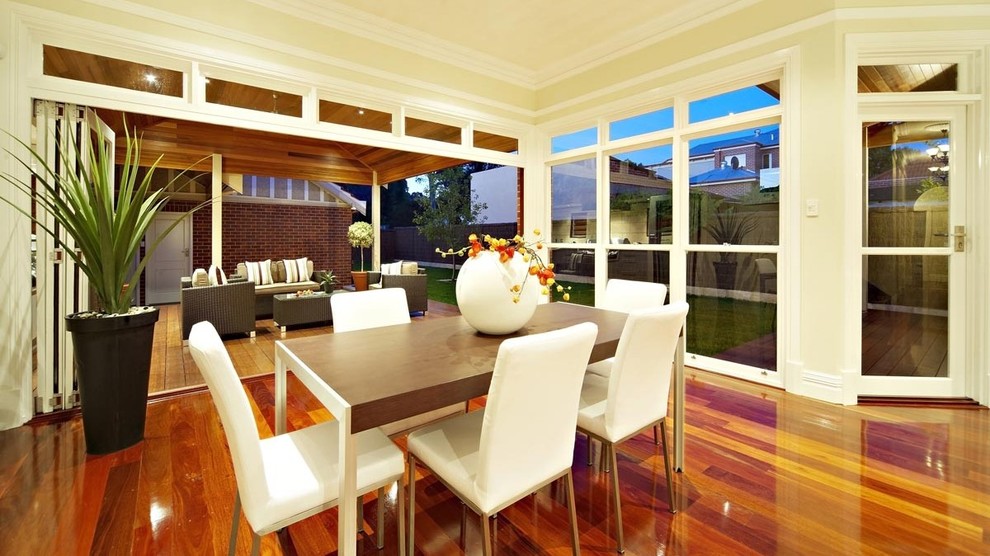 Large contemporary open plan living room in Perth with light hardwood flooring.