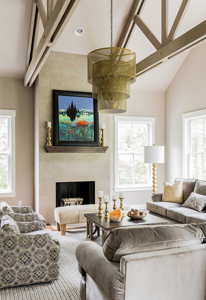 Traditional formal and grey and cream enclosed living room in Boston with medium hardwood flooring, a standard fireplace, beige walls and no tv.