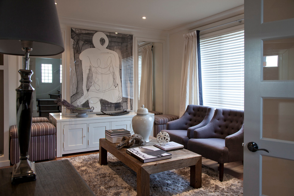 Immagine di un soggiorno contemporaneo di medie dimensioni e chiuso con pareti beige