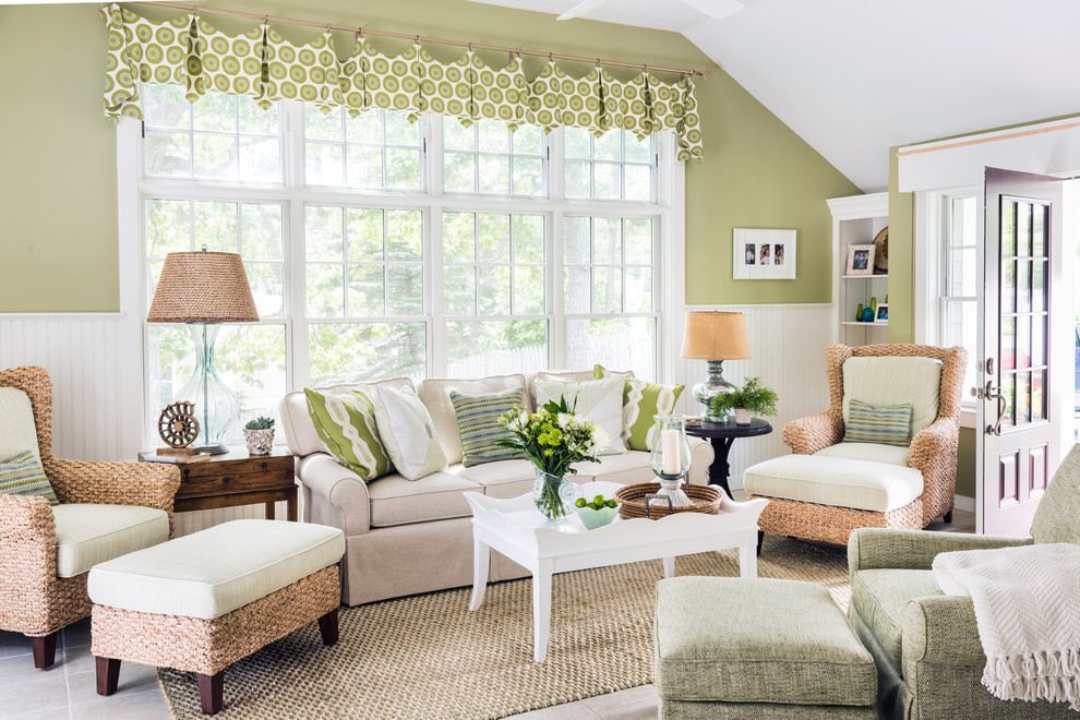 Beach style enclosed living room in Boston with green walls and grey floors.