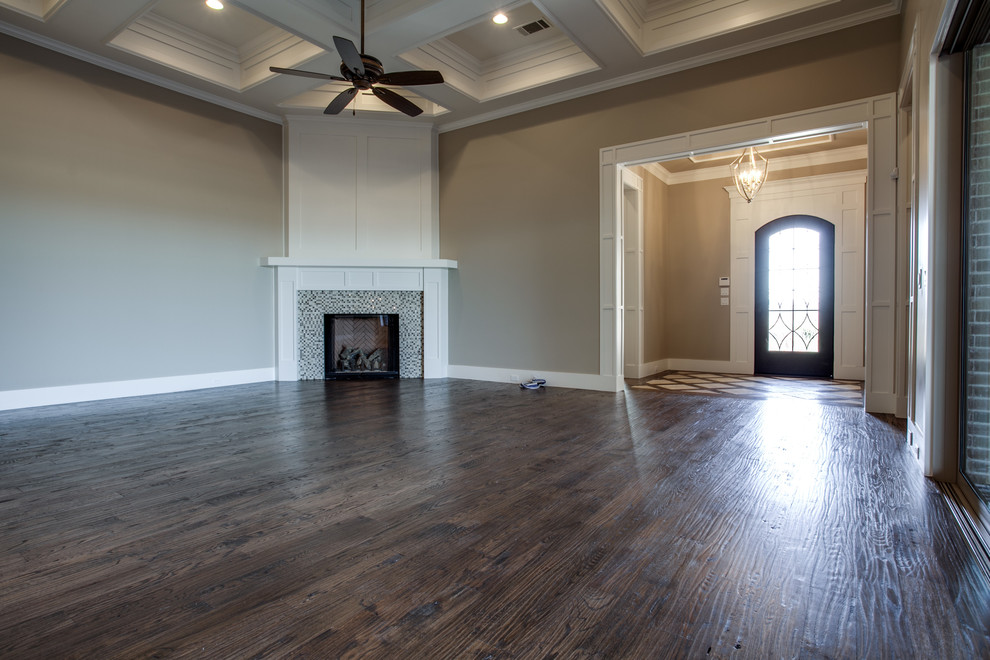 Photo of a medium sized classic open plan living room in Dallas with beige walls, medium hardwood flooring, a corner fireplace, a tiled fireplace surround and a wall mounted tv.
