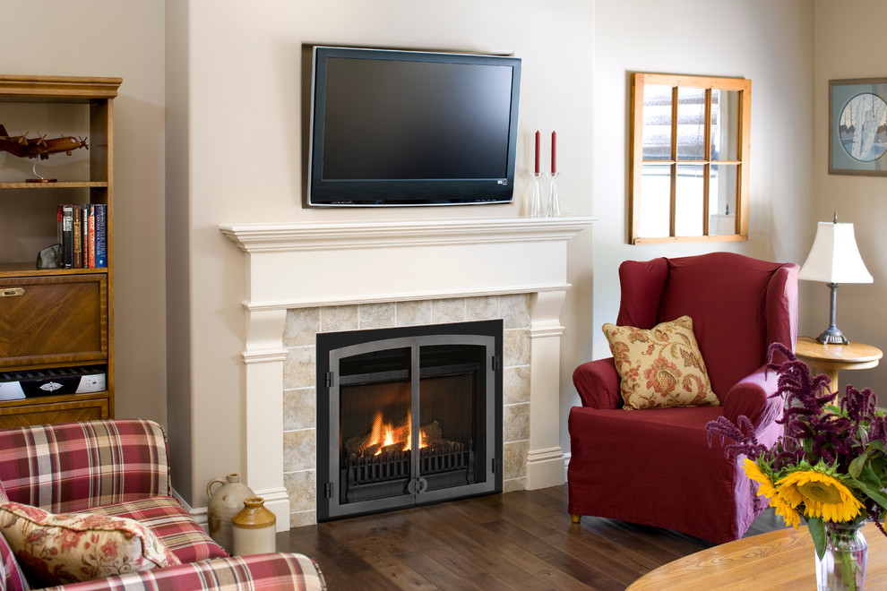 Example of a large classic dark wood floor living room design in Salt Lake City with white walls, a standard fireplace, a stone fireplace and a wall-mounted tv
