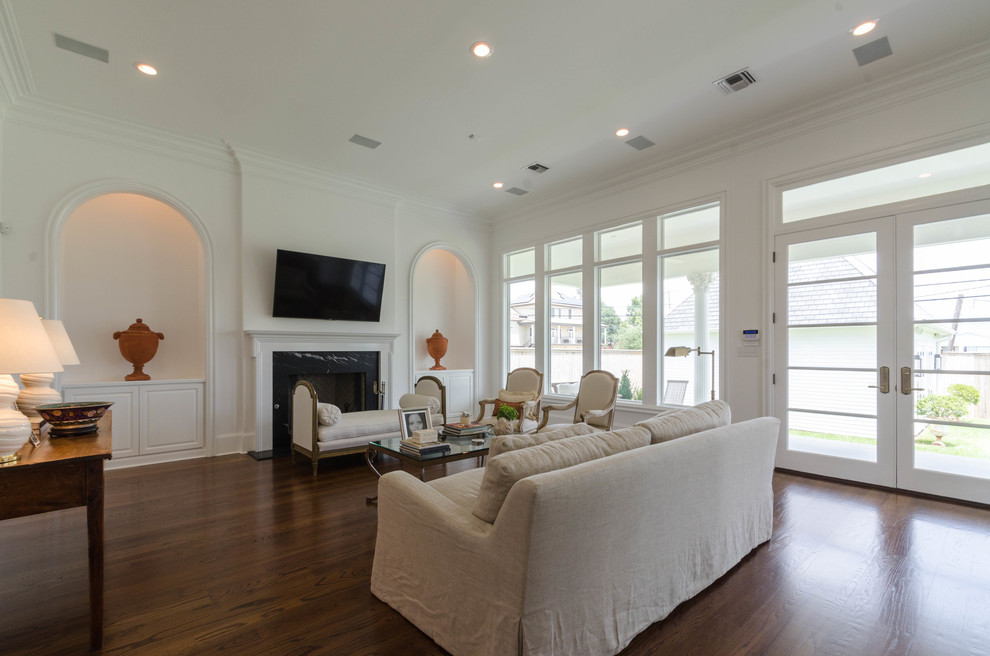 Mid-sized elegant formal and enclosed dark wood floor living room photo in New Orleans with white walls, a standard fireplace, a tile fireplace and a wall-mounted tv