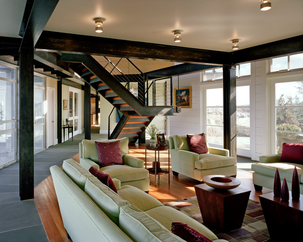 Living room - coastal open concept medium tone wood floor living room idea in Boston with white walls