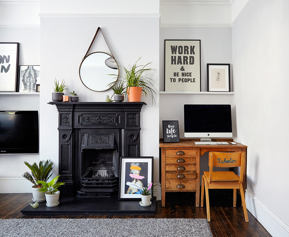 Inspiration for a mid-sized scandinavian formal and open concept dark wood floor living room remodel in London with white walls and a wall-mounted tv