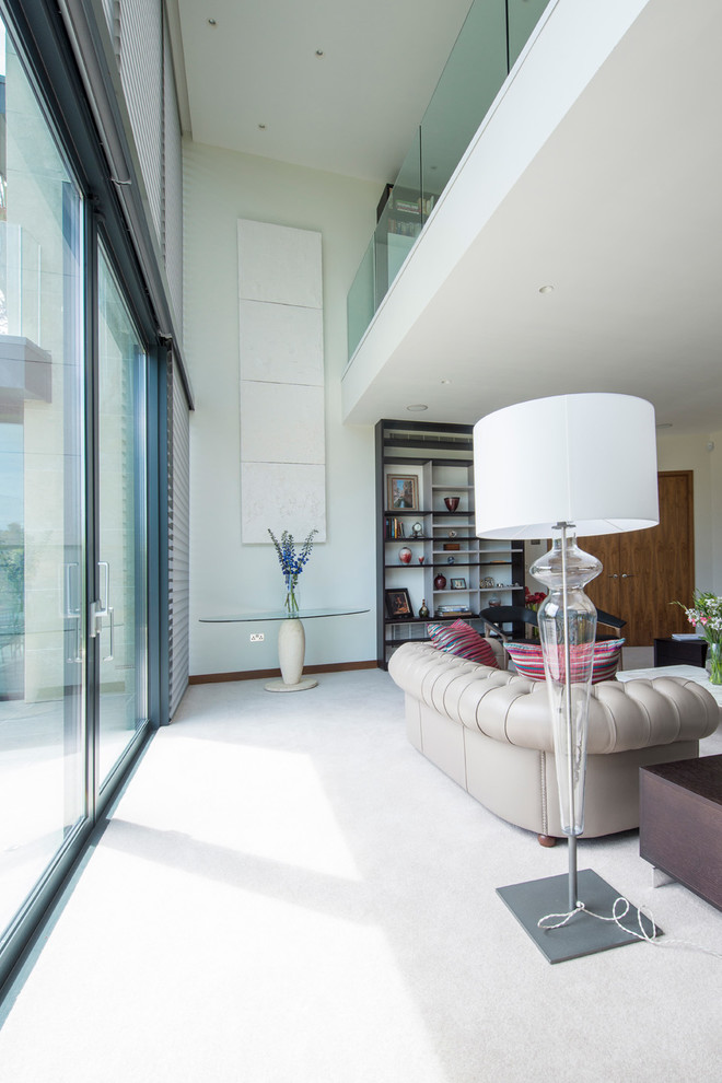 This is an example of a contemporary living room in Dorset with feature lighting.