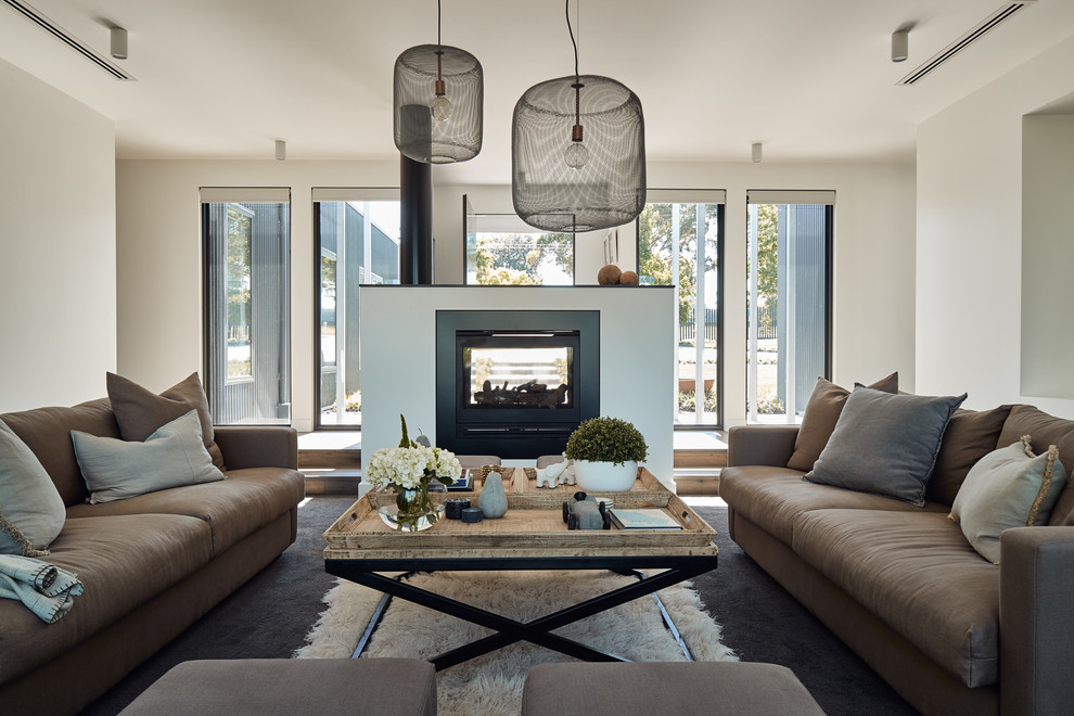 Inspiration for a large contemporary formal open plan living room in Melbourne with white walls, carpet, a two-sided fireplace, a plastered fireplace surround, no tv and grey floors.