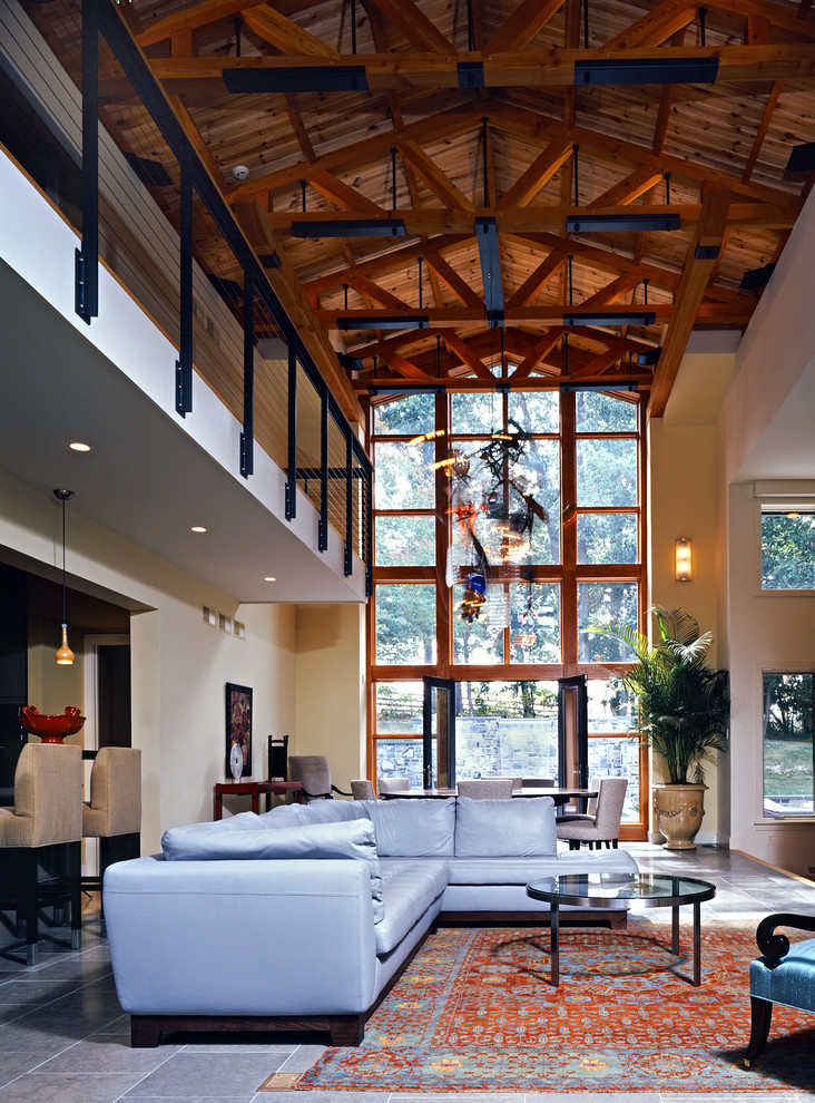 Example of a huge trendy open concept living room design in Philadelphia with beige walls