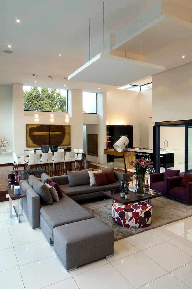 This is an example of a contemporary open plan living room in Other with beige walls and no tv.