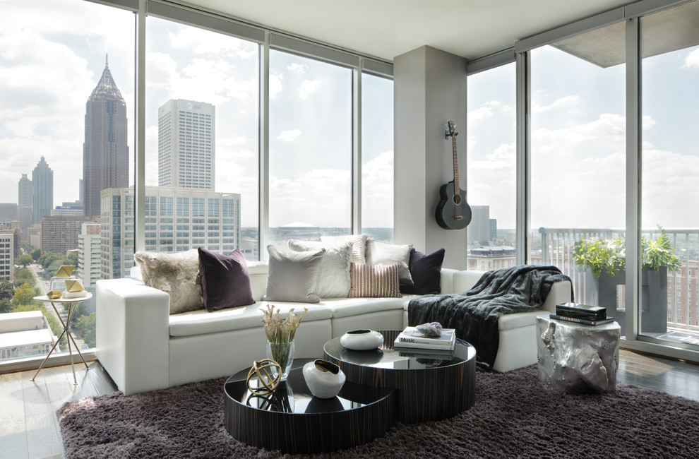 Medium sized contemporary open plan living room in Atlanta with grey walls and dark hardwood flooring.
