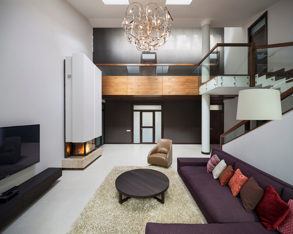 Стильный дизайн: двухуровневая гостиная комната в современном стиле - последний тренд