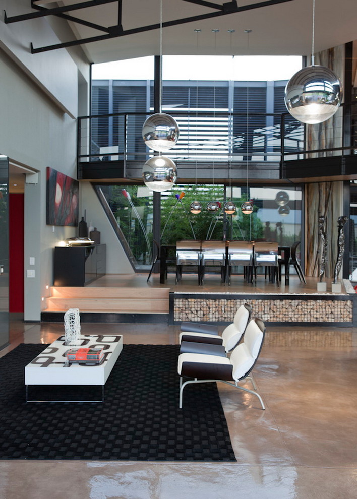 Свежая идея для дизайна: открытая гостиная комната в современном стиле с серыми стенами и бетонным полом - отличное фото интерьера