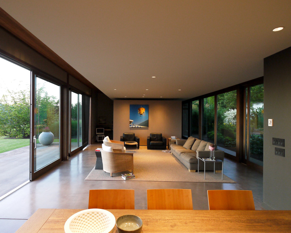 Ispirazione per un soggiorno contemporaneo di medie dimensioni e aperto con pareti verdi e pavimento in cemento