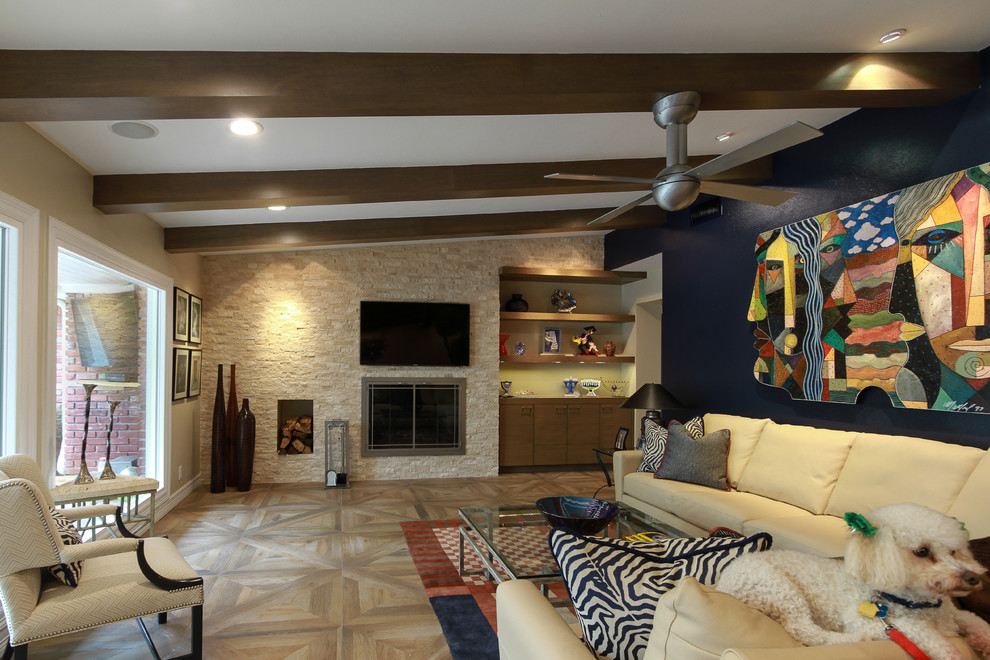 Example of a mid-sized trendy open concept porcelain tile living room design in Houston with beige walls, a standard fireplace, a stone fireplace and a wall-mounted tv