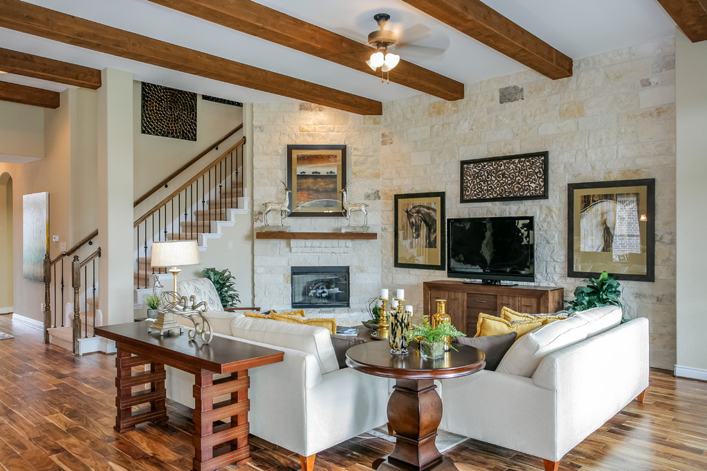 Example of a large open concept medium tone wood floor living room design in Austin with beige walls, a corner fireplace and a stone fireplace